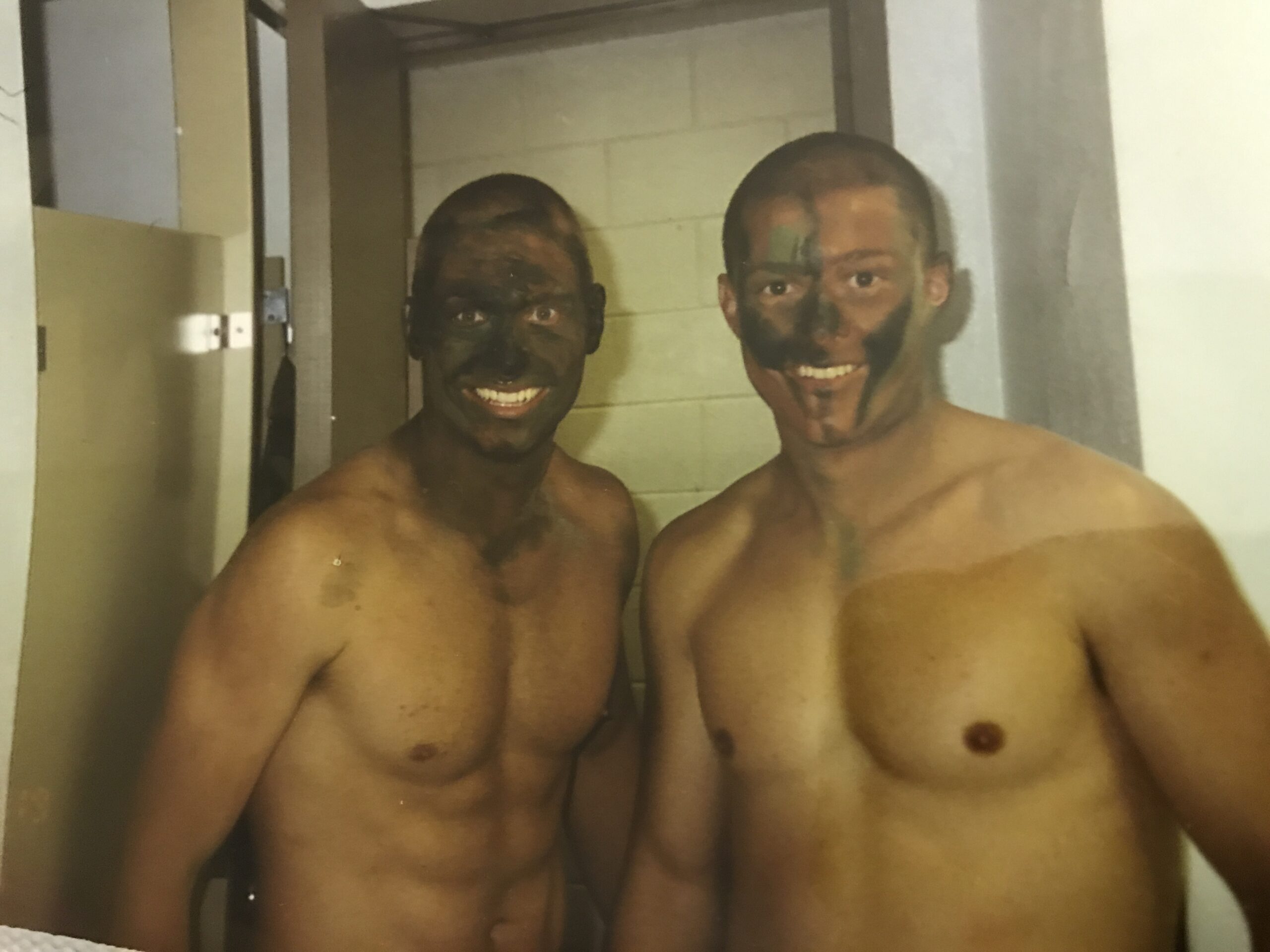 John Siver II in camouflage face paint during training